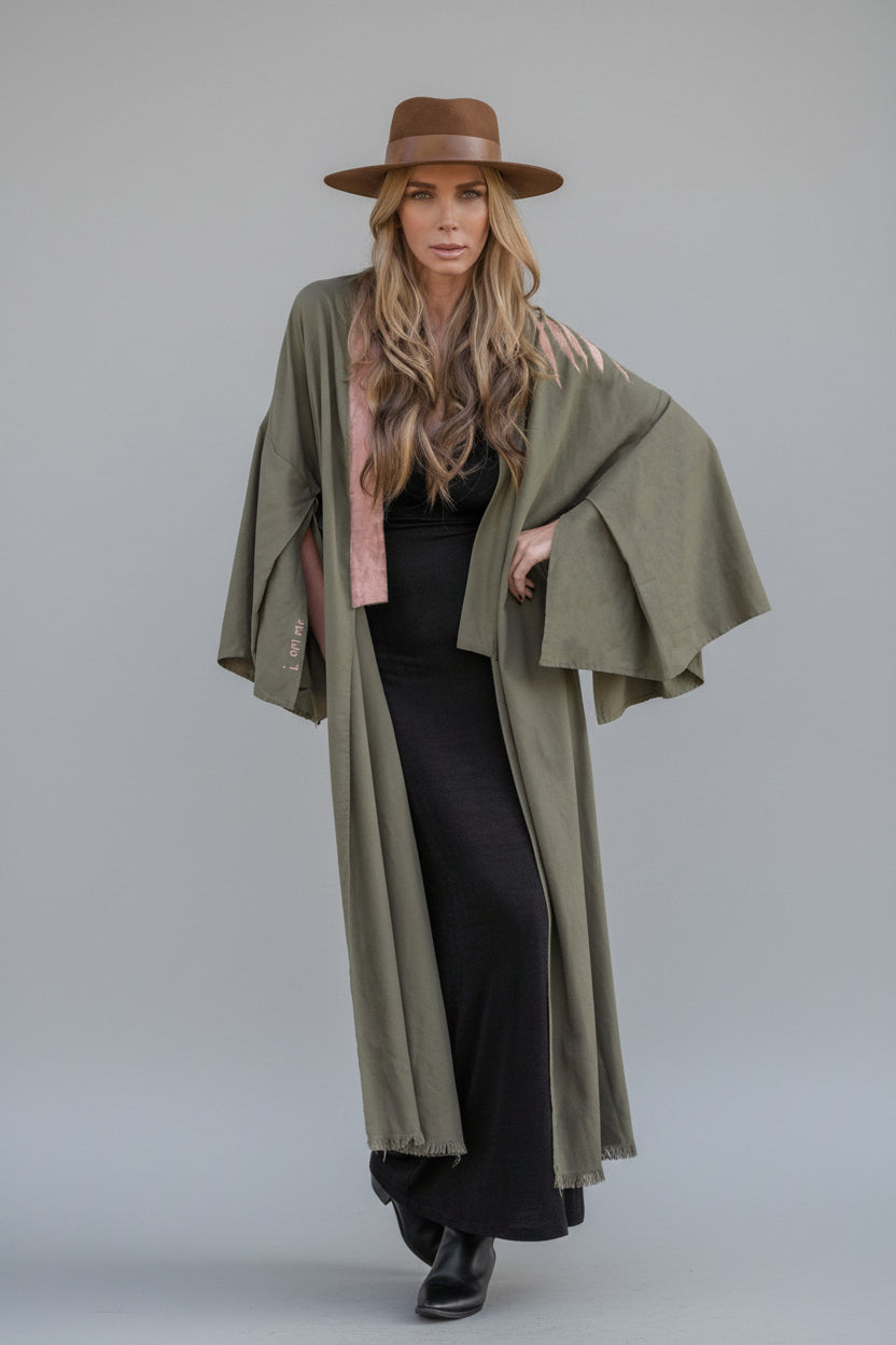 model wearing a long hand-painted house of malibu kimono with branch detailing shoulder design
